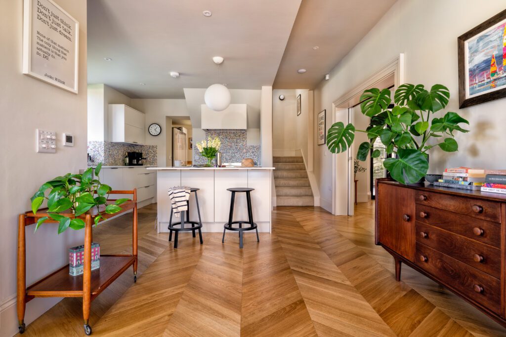 A glass-fronted gem in Kingswear, blending mid-century charm with stunning river and sea views. Architectural Interior Photography by Sue Vaughton