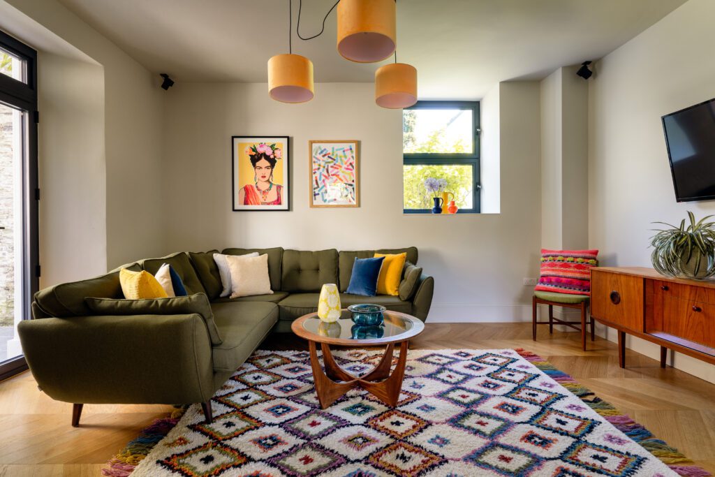 A glass-fronted gem in Kingswear, blending mid-century charm with stunning river and sea views. Architectural Interior Photography by Sue Vaughton