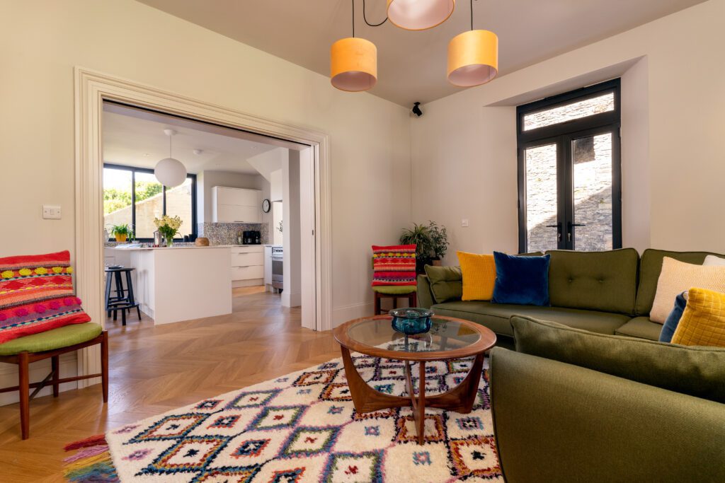 A glass-fronted gem in Kingswear, blending mid-century charm with stunning river and sea views. Architectural Interior Photography by Sue Vaughton