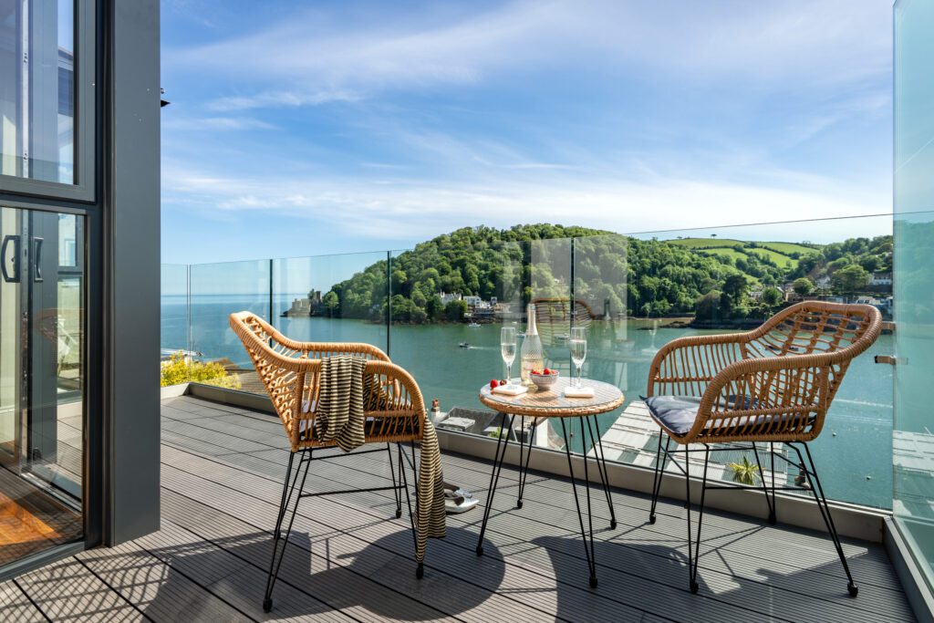 A glass-fronted gem in Kingswear, blending mid-century charm with stunning river and sea views. Architectural Interior Photography by Sue Vaughton
