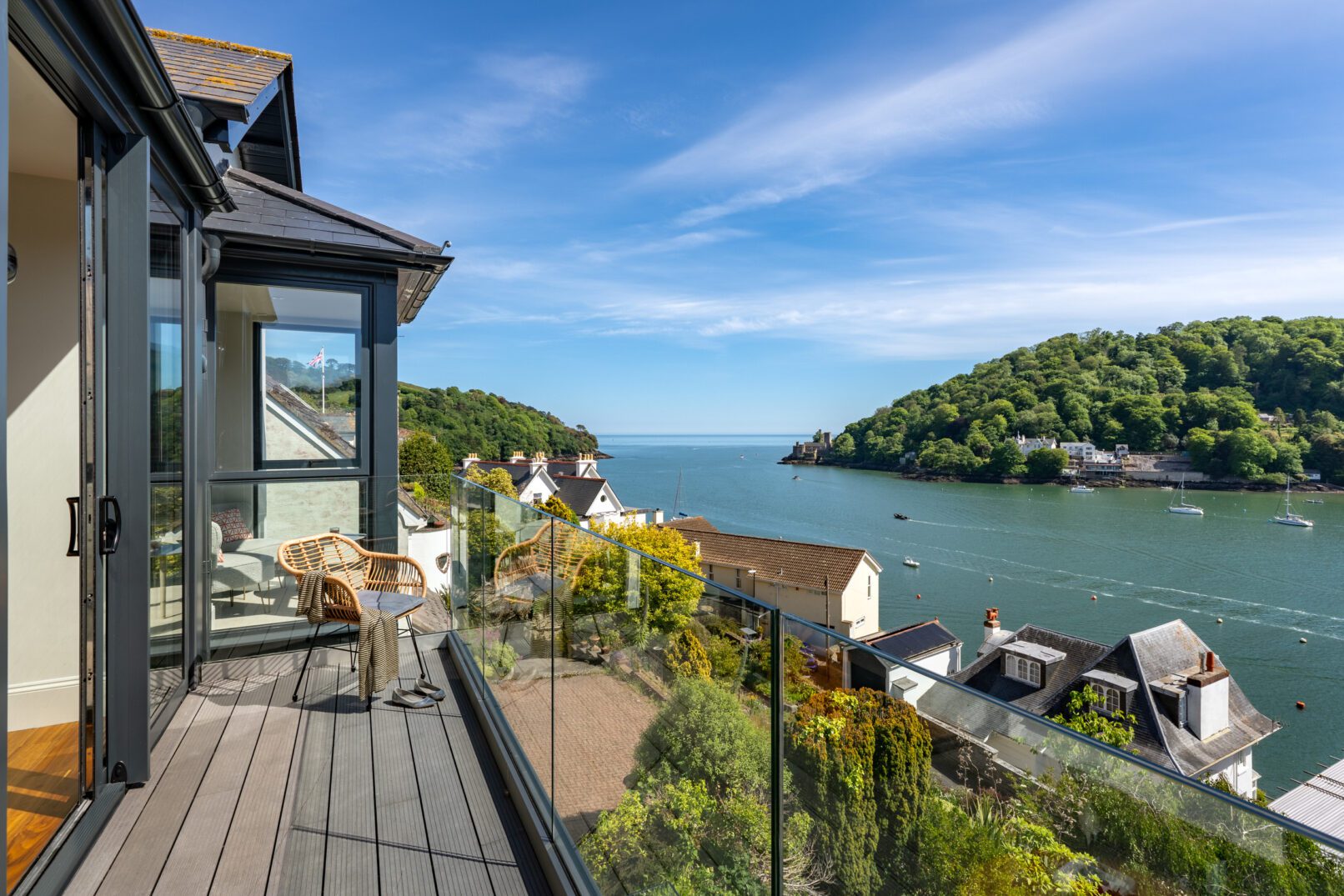 Glass-fronted gem in Kingswear blending mid-century charm with stunning river and sea views in Kingswear. Interior and architectural photography by Sue Vaughton.