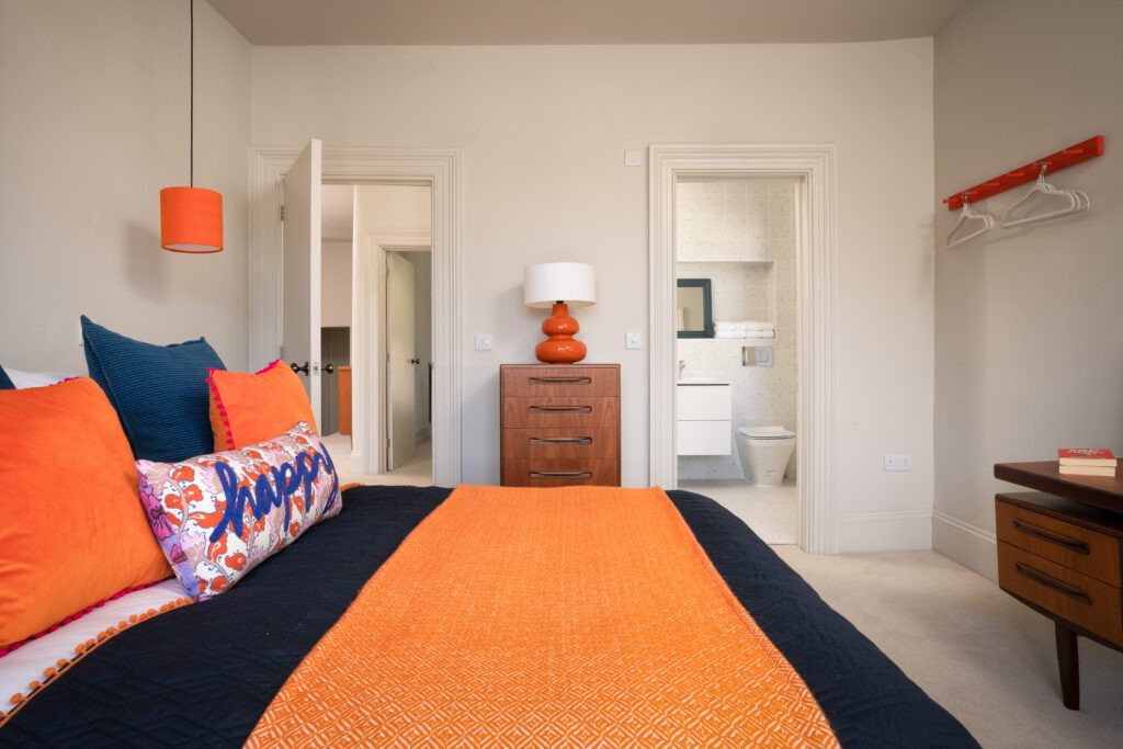 A glass-fronted gem in Kingswear, blending mid-century charm with stunning river and sea views. Architectural Interior Photography by Sue Vaughton