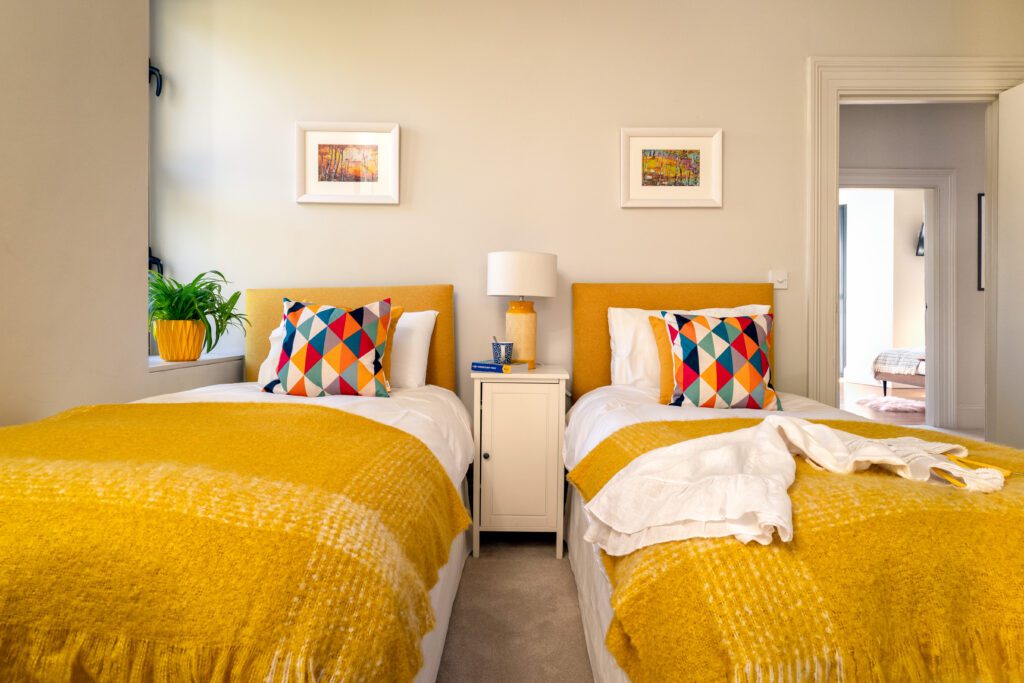 A glass-fronted gem in Kingswear, blending mid-century charm with stunning river and sea views. Architectural Interior Photography by Sue Vaughton