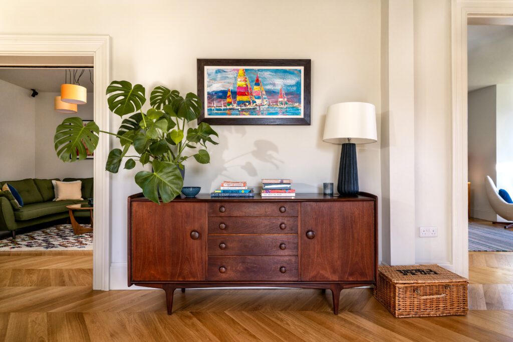 A glass-fronted gem in Kingswear, blending mid-century charm with stunning river and sea views.