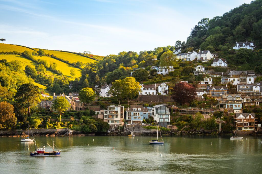 A glass-fronted gem in Kingswear, blending mid-century charm with stunning river and sea views. Architectural Interior Photography by Sue Vaughton