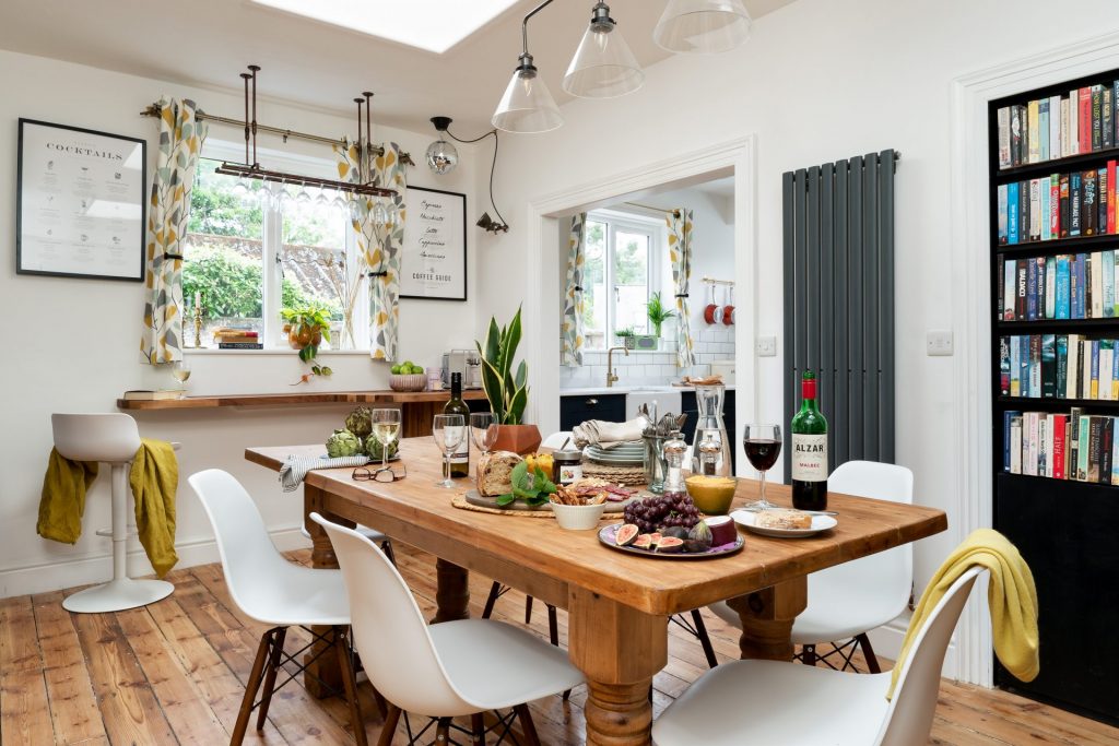 St Maur Cottage’s kitchen featuring stripped wooden flooring and stylish details. Captured by interior photographer Sue Vaughton.