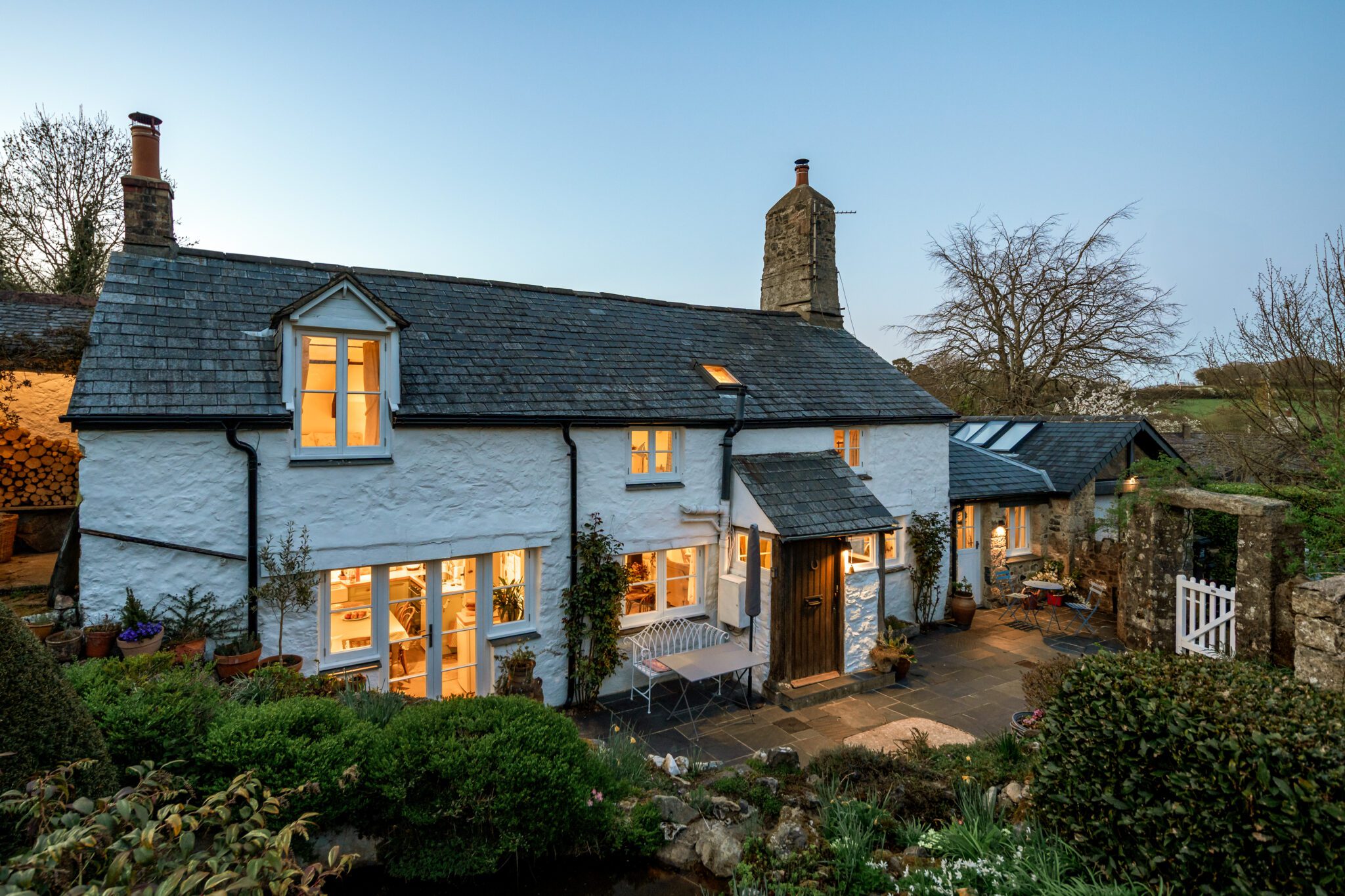 blue hour dusk photograph of stares' nest cottage in May